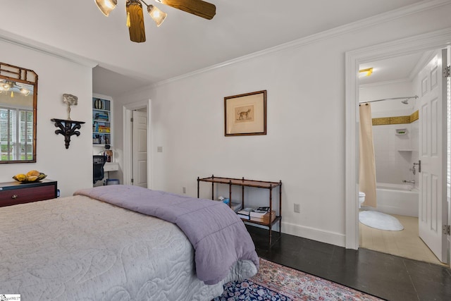 bedroom with ceiling fan, crown molding, and ensuite bath