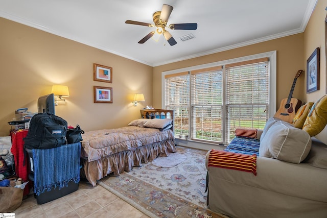 tiled bedroom with ceiling fan and ornamental molding