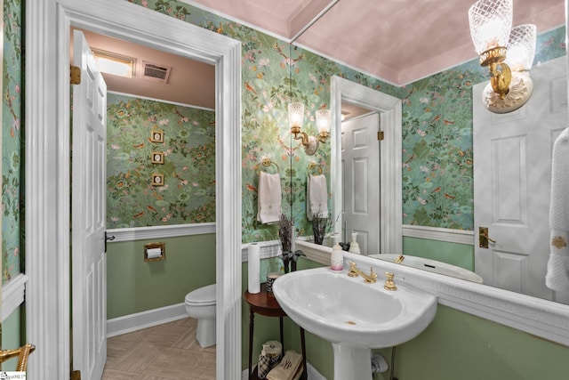 bathroom with tile patterned floors, toilet, and sink