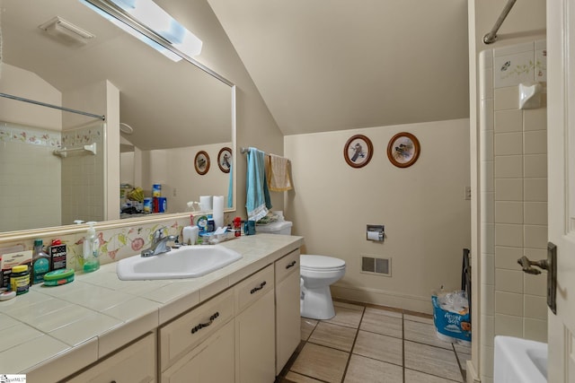 full bathroom with tile patterned floors, vanity, and vaulted ceiling