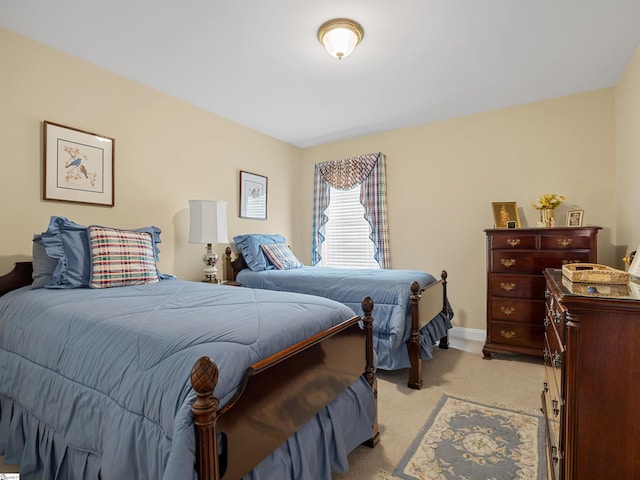 bedroom featuring light colored carpet