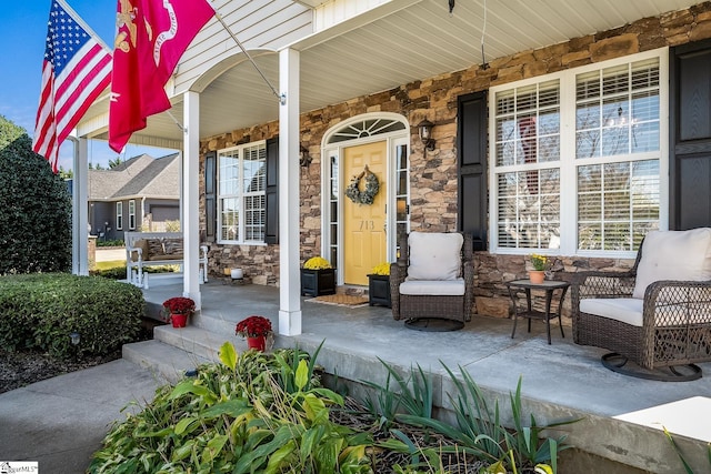 doorway to property featuring covered porch