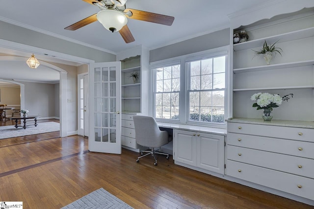 home office featuring french doors, crown molding, ceiling fan, and dark wood-type flooring