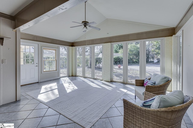 sunroom featuring ceiling fan and lofted ceiling