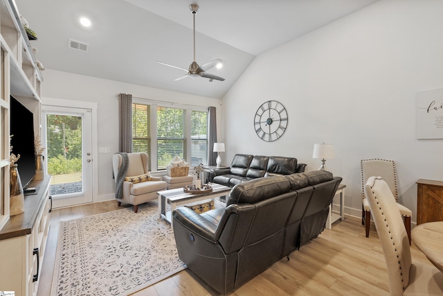 living room with light wood-type flooring, vaulted ceiling, and ceiling fan