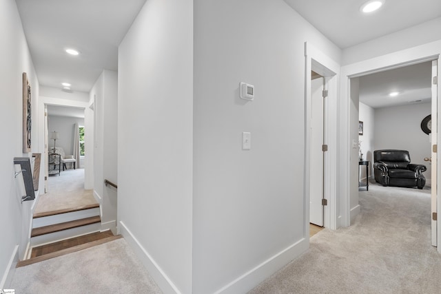 corridor with light colored carpet