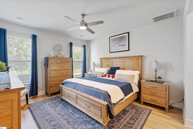 bedroom featuring light hardwood / wood-style floors and ceiling fan