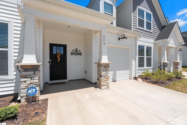 property entrance featuring a porch and a garage