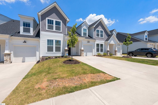 view of front of home featuring a garage and a front yard