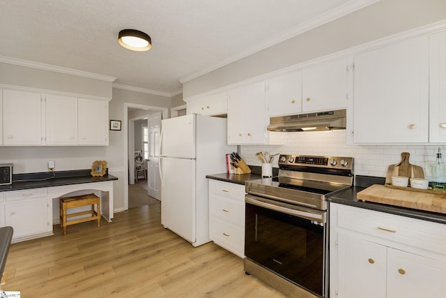 kitchen featuring white fridge, electric stove, ornamental molding, and white cabinetry