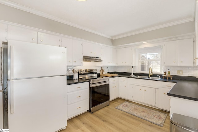 kitchen with sink, exhaust hood, white cabinets, white fridge, and stainless steel electric range oven