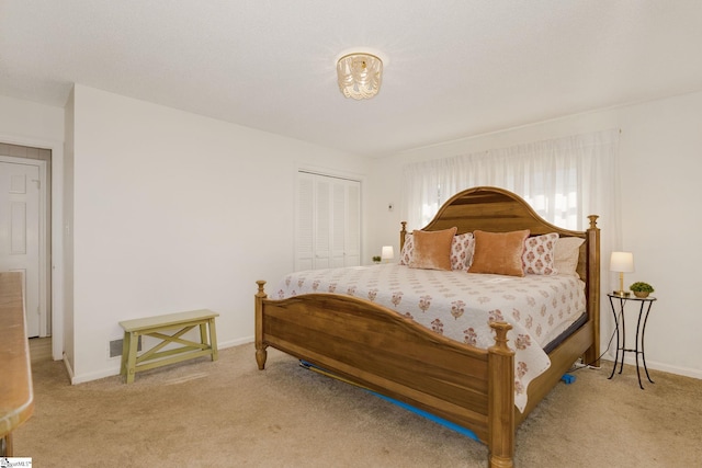 bedroom featuring light carpet and a closet