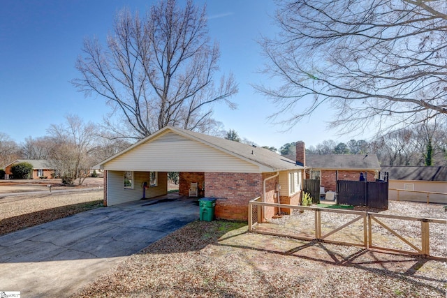 view of side of home with a carport