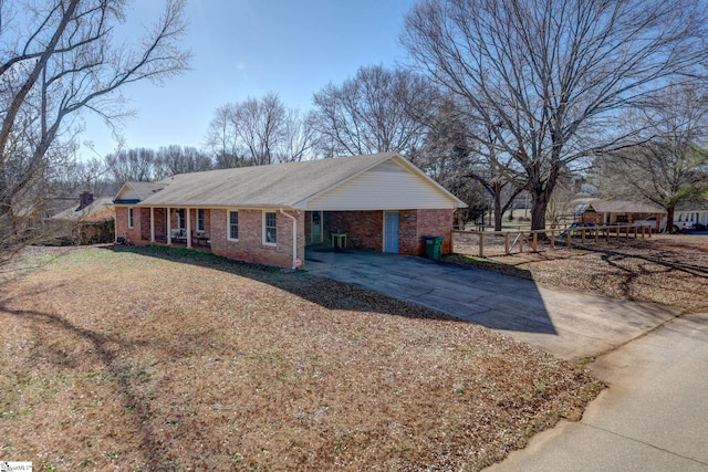 view of front of house with a front lawn and a carport