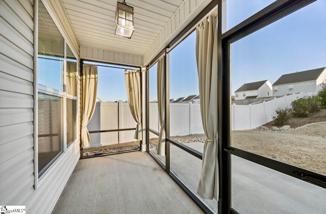 unfurnished sunroom with a wealth of natural light