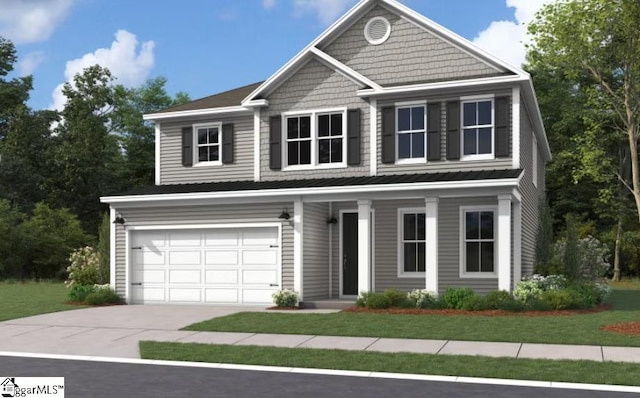 view of front of property featuring a garage and a front lawn