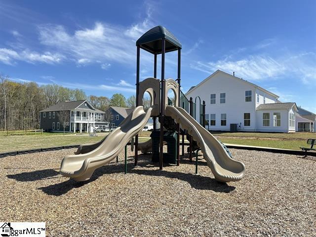 view of jungle gym featuring a lawn