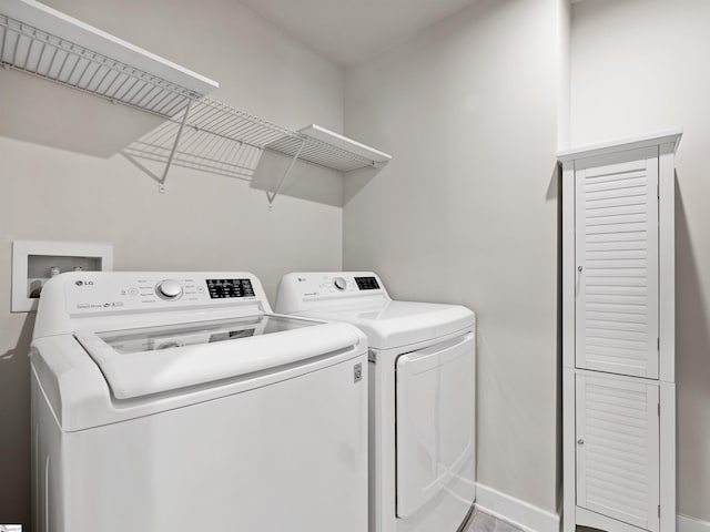 washroom with washing machine and dryer