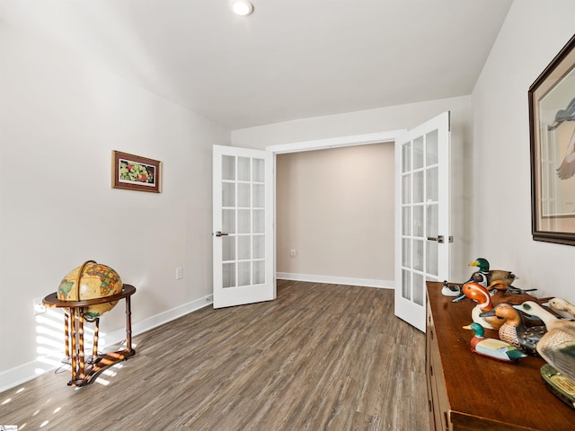 interior space with french doors and dark wood-type flooring