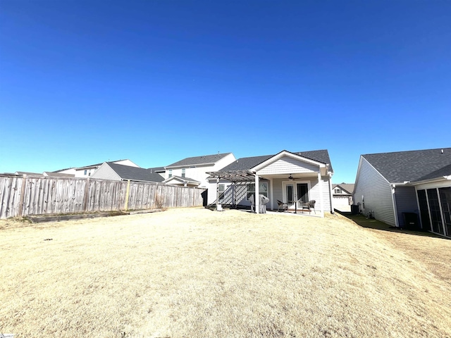 view of yard featuring a pergola, a patio, and ceiling fan