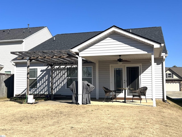 back of property featuring ceiling fan, a pergola, and a patio