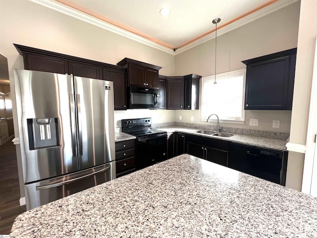 kitchen featuring sink, light stone counters, decorative light fixtures, black appliances, and ornamental molding