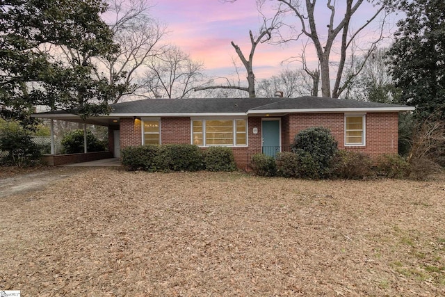 ranch-style house with a carport