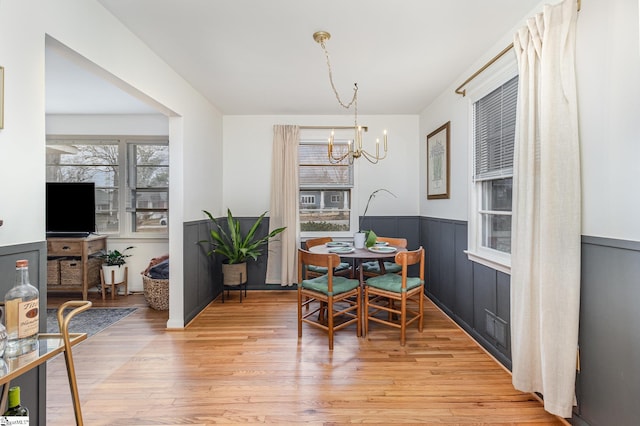 dining area featuring a chandelier and light hardwood / wood-style flooring