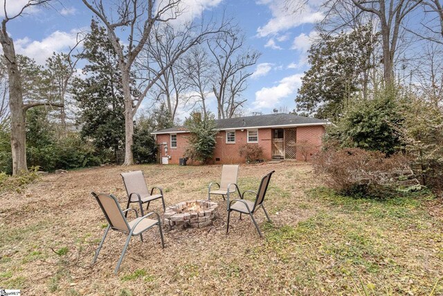 view of yard with an outdoor fire pit