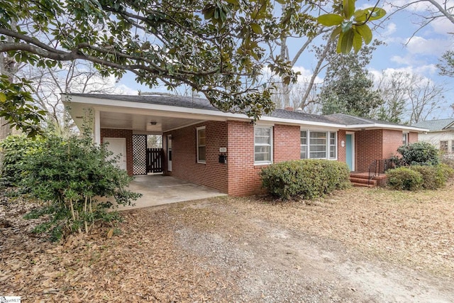 view of front of home with a carport