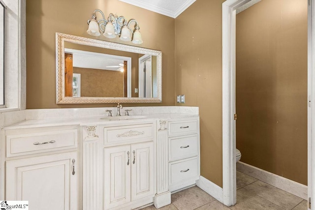 bathroom featuring tile patterned floors, vanity, ceiling fan, crown molding, and toilet