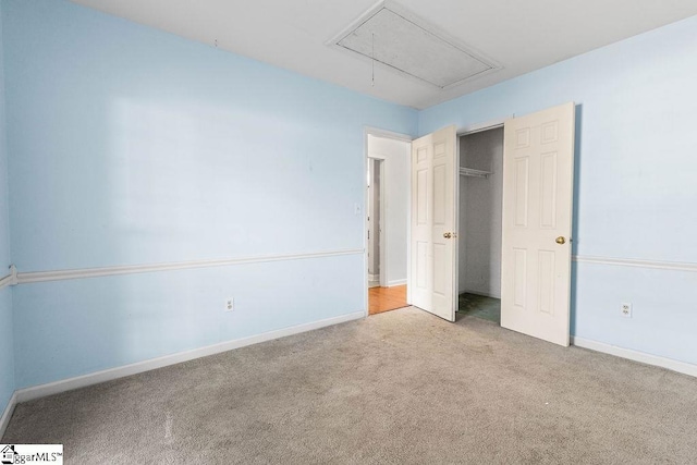 unfurnished bedroom featuring light carpet