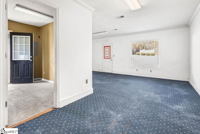 carpeted spare room featuring a textured ceiling, electric panel, and crown molding