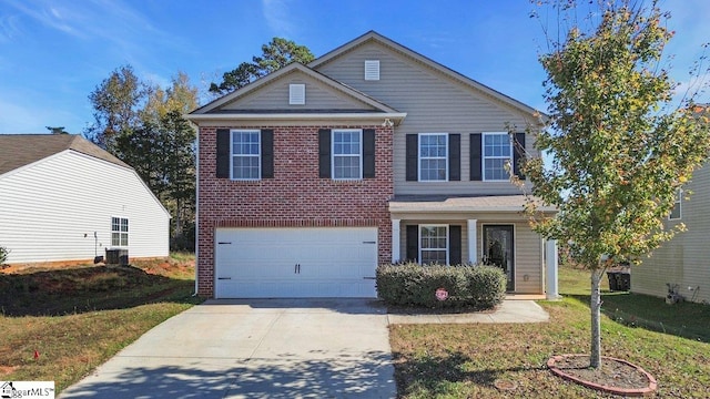 front of property with a front lawn and a garage