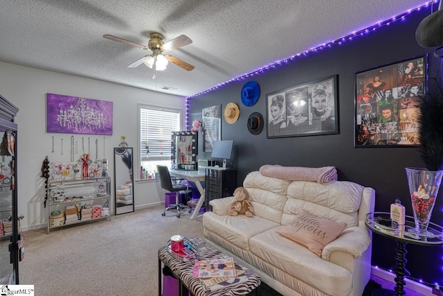 carpeted living room featuring ceiling fan and a textured ceiling