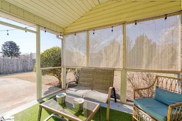 sunroom with lofted ceiling