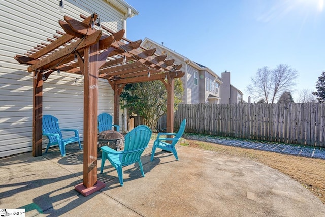 view of patio / terrace featuring a pergola and an outdoor fire pit