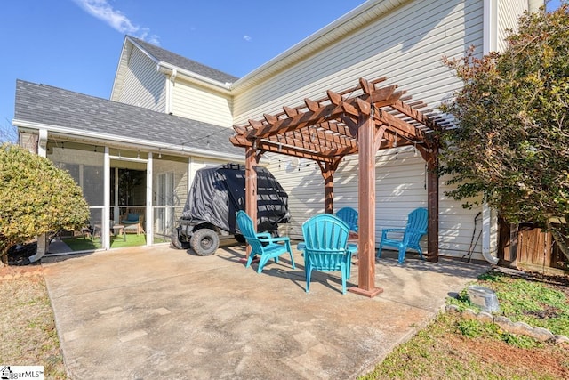 view of patio / terrace with a pergola and a sunroom