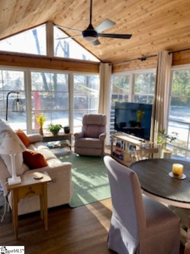 sunroom with ceiling fan, wood ceiling, and vaulted ceiling