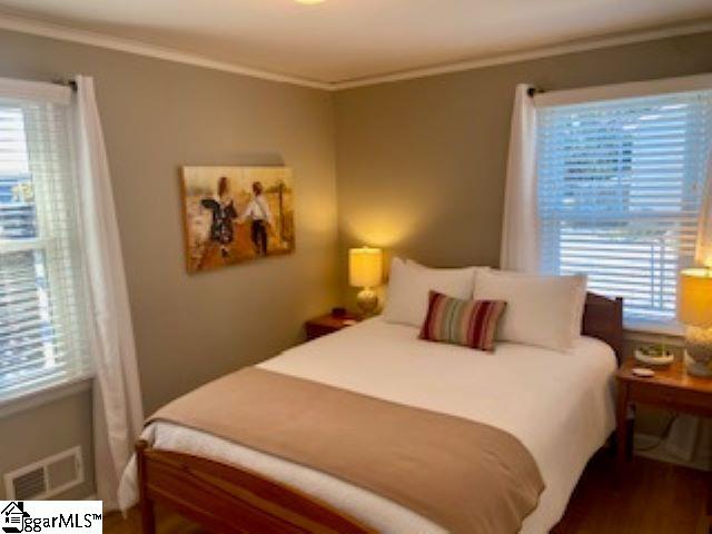 bedroom featuring ornamental molding