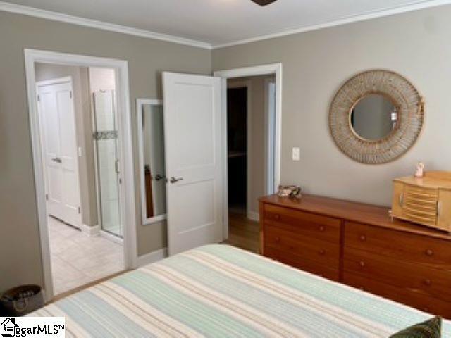 bedroom with ornamental molding