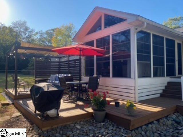 view of home's exterior featuring a sunroom