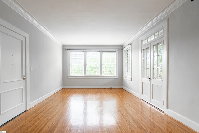 interior space with light hardwood / wood-style flooring and crown molding