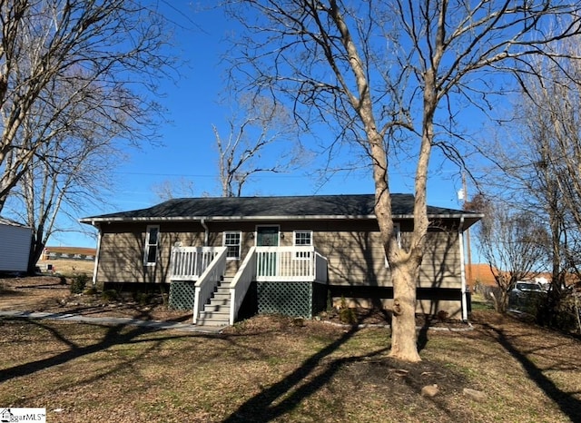 view of front of house featuring a wooden deck