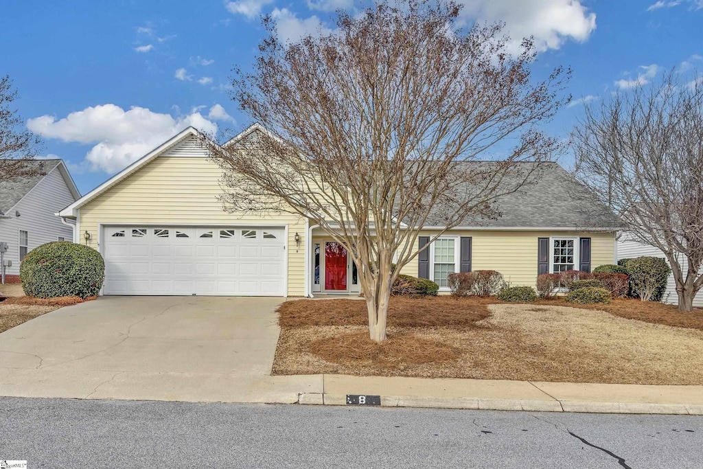 single story home featuring a garage