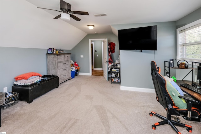 home office with ceiling fan, light carpet, and vaulted ceiling