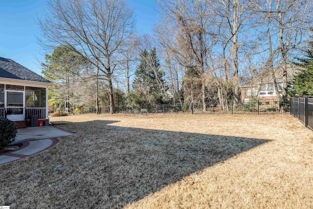 view of yard with a sunroom