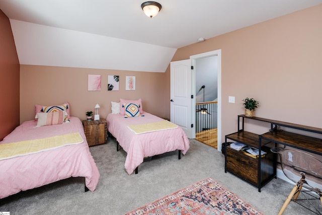 bedroom featuring light carpet and lofted ceiling