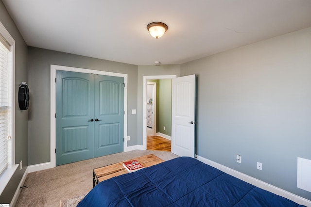 carpeted bedroom with a closet