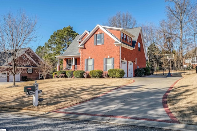 view of front of house with a garage and a front yard